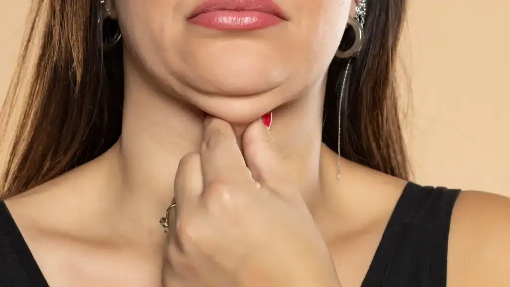 An image of a woman with double chin, sad, worried : Non Surgical Double Chin Removal Treatment in Chester, UK
